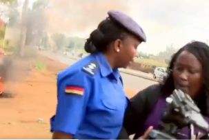 mary Muoki a Citizen TV reporter is blocked by a police officer from taking pictures